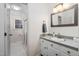 Updated bathroom featuring a walk-in shower, and white cabinets and countertop at 1210 Huntsman Dr, Durham, NC 27713