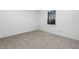 Small bedroom featuring neutral carpet and a window with natural light at 1210 Huntsman Dr, Durham, NC 27713