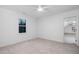 Bedroom featuring neutral carpet, a window providing natural light, and attached bathroom at 1210 Huntsman Dr, Durham, NC 27713