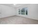 The bedroom features carpet and a bay window at 1210 Huntsman Dr, Durham, NC 27713