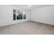 Carpeted bedroom with a large window providing natural light at 1210 Huntsman Dr, Durham, NC 27713