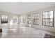 Large bonus room with tile flooring and several windows allowing for ample natural light at 1210 Huntsman Dr, Durham, NC 27713