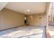 Covered carport area showing access doors, exterior siding, and a convenient, sheltered parking space at 1210 Huntsman Dr, Durham, NC 27713