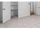 Walk-in closet featuring installed shelves and carpeted floor at 1210 Huntsman Dr, Durham, NC 27713