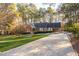 A charming one-story home with a well-maintained lawn at 1210 Huntsman Dr, Durham, NC 27713