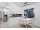 Eat-in kitchen featuring stainless appliances, white cabinets, and a breakfast nook with a backyard view at 1210 Huntsman Dr, Durham, NC 27713