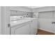 Laundry room with washer, dryer, and shelving at 1210 Huntsman Dr, Durham, NC 27713