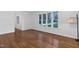 The living room features hardwood floors and large windows that allow ample natural light at 1210 Huntsman Dr, Durham, NC 27713