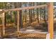 A spacious covered patio featuring a built-in bench, ideal for outdoor relaxation at 1210 Huntsman Dr, Durham, NC 27713