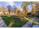 Beautifully landscaped yard with a variety of trees and greenery, creating a serene outdoor space at 1210 Huntsman Dr, Durham, NC 27713