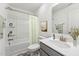 Clean bathroom with shower/tub combo, vanity, and decorative accents at 124 Camel Crazies Pl # 43, Lillington, NC 27546