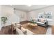 Living room with hardwood floors, light walls, and comfortable seating at 124 Camel Crazies Pl # 43, Lillington, NC 27546
