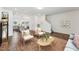 Living area with hardwood floors, and view into kitchen at 124 Camel Crazies Pl # 43, Lillington, NC 27546