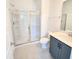 Bathroom with walk-in shower and dark vanity at 2119 Treelight Way, Wendell, NC 27591