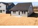 View of the home's backyard with freshly installed grass, showcasing a neat and tidy space at 213 Little Crk Dr, Lillington, NC 27546