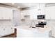 Stylish kitchen with modern appliances, a spacious island, and elegant pendant lighting at 213 Little Crk Dr, Lillington, NC 27546