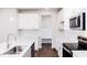 Modern kitchen with stainless steel appliances, white cabinetry, and a stylish island at 213 Little Crk Dr, Lillington, NC 27546