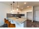 Modern kitchen with granite countertops, stainless steel appliances, and white shaker cabinets at 2206 Gathering Sq Ct # 2206, Fuquay Varina, NC 27526