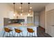 Modern kitchen with granite countertops, stainless steel appliances, and white shaker cabinets at 2206 Gathering Sq Ct # 2206, Fuquay Varina, NC 27526