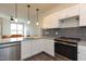 Modern kitchen with granite countertops, stainless steel appliances, and white shaker cabinets at 2206 Gathering Sq Ct # 2206, Fuquay Varina, NC 27526