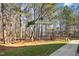 Private backyard with wooded area and pathway at 2225 Raven Rd # 107, Raleigh, NC 27614