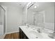 Bathroom with double vanity and shower at 2225 Raven Rd # 107, Raleigh, NC 27614