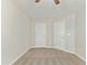Spacious bedroom with carpeted floor and two closets at 2225 Raven Rd # 107, Raleigh, NC 27614