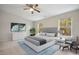 Spacious bedroom with large windows and ceiling fan at 2225 Raven Rd # 107, Raleigh, NC 27614