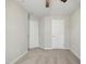 Spacious bedroom with carpeted floor and two closets at 2225 Raven Rd # 107, Raleigh, NC 27614