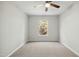 Bright bedroom with carpeted floor and large window at 2225 Raven Rd # 107, Raleigh, NC 27614
