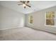 Simple bedroom with neutral walls and carpet flooring at 2225 Raven Rd # 107, Raleigh, NC 27614