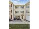 Three-story townhome with patio and landscaping at 2225 Raven Rd # 107, Raleigh, NC 27614