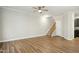 Living room with hardwood floors and stairs leading upstairs at 2225 Raven Rd # 107, Raleigh, NC 27614