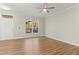Bright living room featuring hardwood floors and a large window at 2225 Raven Rd # 107, Raleigh, NC 27614