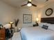 Comfortable bedroom with soft lighting, inviting bed, and stylish decor at 2313 Gathering Square Ct # 2313, Fuquay Varina, NC 27526