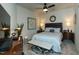 Bedroom features a well-lit room with neutral colors, comfortable bed, and stylish decor at 2313 Gathering Square Ct # 2313, Fuquay Varina, NC 27526
