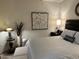 Main bedroom with large bed, nightstands, and artwork at 2313 Gathering Square Ct # 2313, Fuquay Varina, NC 27526