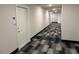 Modern apartment hallway with neutral walls and patterned carpet at 2313 Gathering Square Ct # 2313, Fuquay Varina, NC 27526