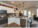 Bright, open kitchen with stainless steel appliances and access to the living area at 2313 Gathering Square Ct # 2313, Fuquay Varina, NC 27526