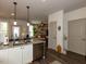 Open-concept layout seamlessly integrates the kitchen, dining, and living areas at 2313 Gathering Square Ct # 2313, Fuquay Varina, NC 27526