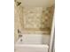 Clean bathroom with shower/tub combo and tile surround at 3 Moss Spring Ct, Durham, NC 27712