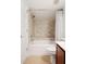 Clean bathroom with beige tiled walls and a shower/tub combo at 3 Moss Spring Ct, Durham, NC 27712