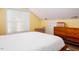 Bright bedroom with mid-century modern dresser and window at 3 Moss Spring Ct, Durham, NC 27712