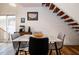 Bright dining area with marble table and modern chairs, near staircase at 3 Moss Spring Ct, Durham, NC 27712