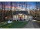 Charming craftsman style home with a red door and attached garage at 3 Moss Spring Ct, Durham, NC 27712