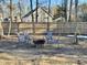 Relaxing firepit area with seating for guests at 3 Moss Spring Ct, Durham, NC 27712