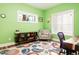 Bright home office features a comfortable chair, built-in shelving, and a workspace at 3 Moss Spring Ct, Durham, NC 27712