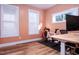Home office with hardwood floors and Peloton bike at 3 Moss Spring Ct, Durham, NC 27712