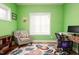 Bright home office features a comfortable chair, built-in shelving, and a workspace at 3 Moss Spring Ct, Durham, NC 27712