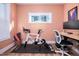 Home office with hardwood floors and Peloton bike at 3 Moss Spring Ct, Durham, NC 27712